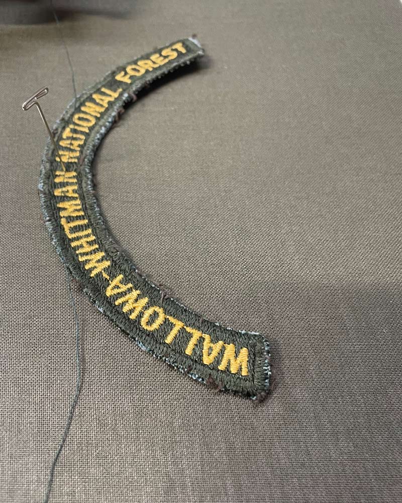 An arc-shaped green patch with the text 
