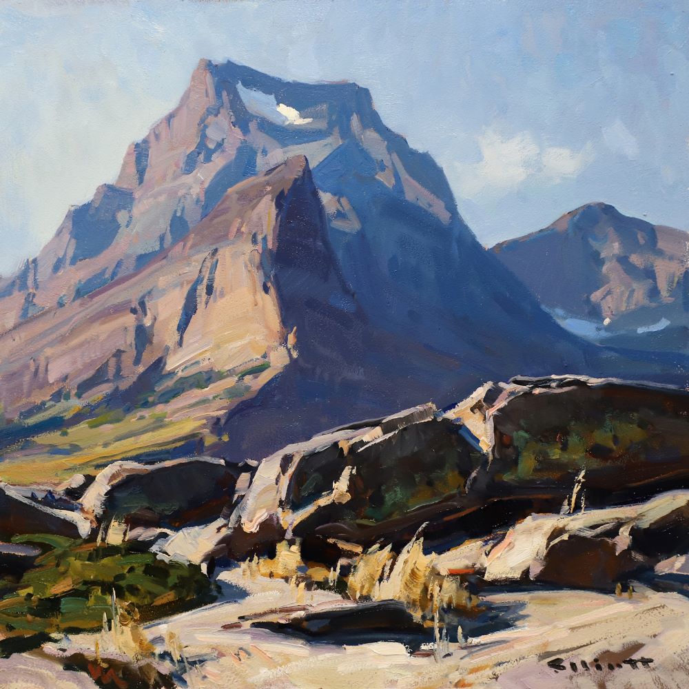 An oil painting with a boulder field shadowed in the foreground and a prominent mountain peak rising into the sky with small patches of snow.